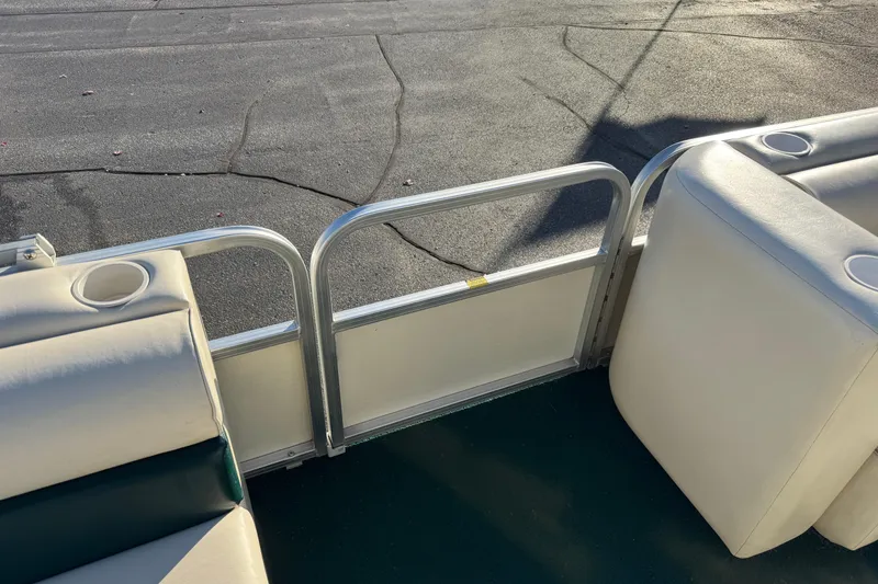 Slide: The Image of 2003 Odyssey Pontoons 2102 Millennium interior with seating and cup holders. - 19
