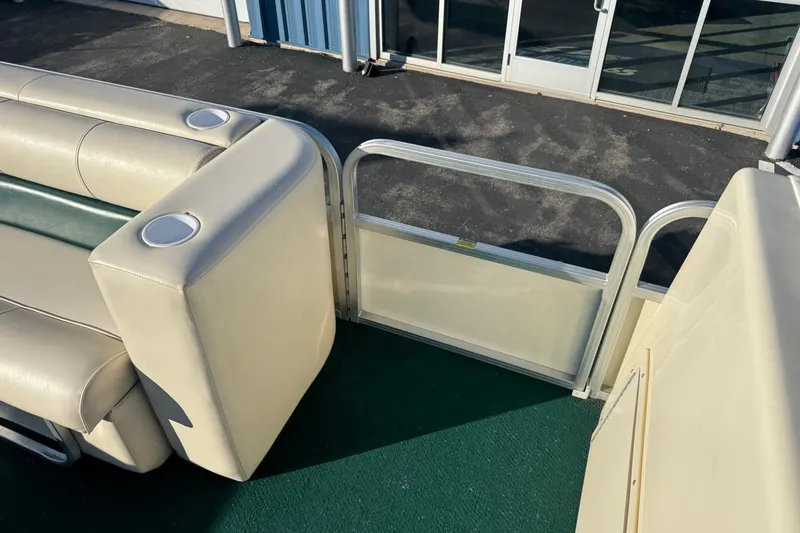 Slide: The Image of 2003 Odyssey Pontoons 2102 Millennium interior with beige seating and cup holders. - 20