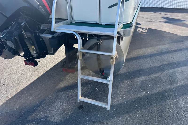 Slide: The Image of Rear view of 2003 Odyssey Pontoons 2102 Millennium with ladder and motor. - 21