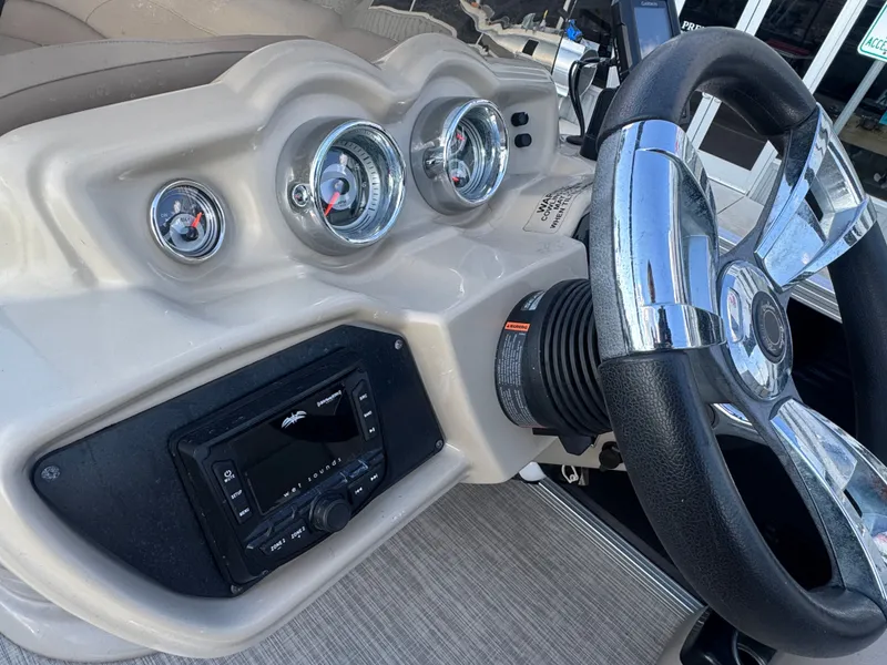 Slide: The Image of Steering console of 2017 Avalon LSZ rf 2285 boat with gauges and controls. - 21