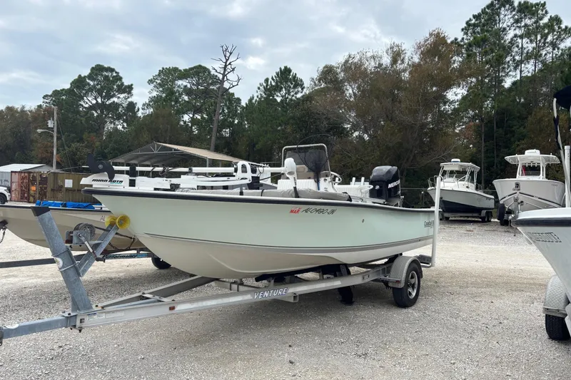 Slide: The Image of 2007 Action Craft Coastal Craft boat on trailer in outdoor storage area. - 1
