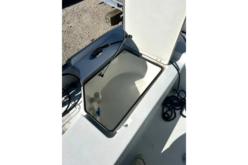 Slide: The Image of Open storage compartment on 2007 Action Craft Coastal Bay boat deck. - 9