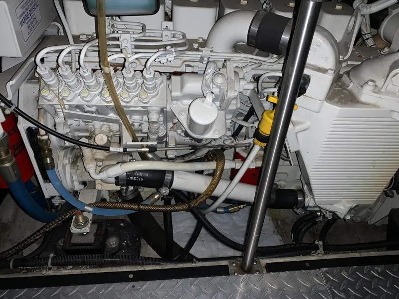 Slide: The Image of Engine compartment of a 2001 Carver 396 Motor Yacht, showcasing intricate mechanical components. - 19
