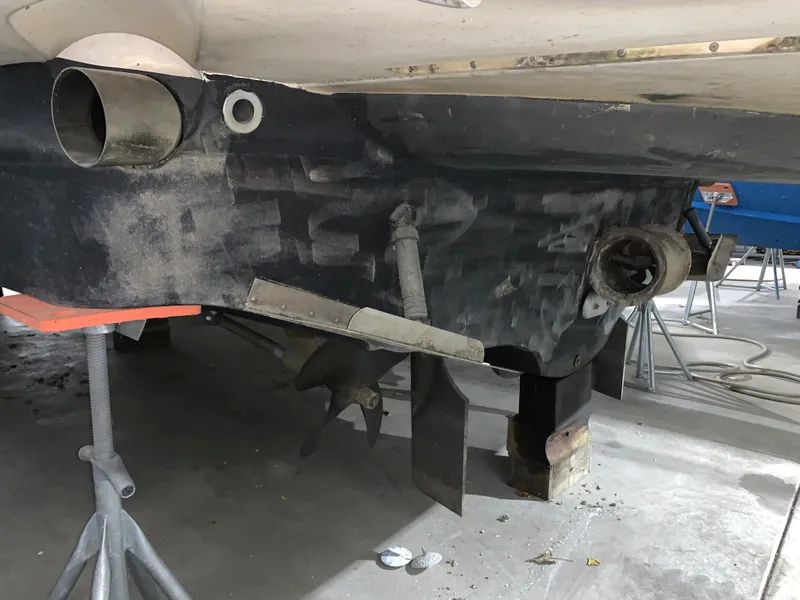 Slide: The Image of 2001 Carver 396 Motor Yacht under maintenance, showing hull and propeller details. - 6