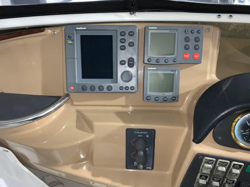Slide: The Image of Control panel of a 2001 Carver 396 Motor Yacht with navigation instruments. - 12