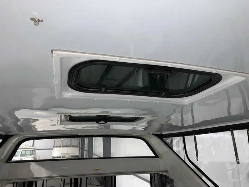 Slide: The Image of Ceiling view of 2001 Carver 396 Motor Yacht with open hatch window. - 14