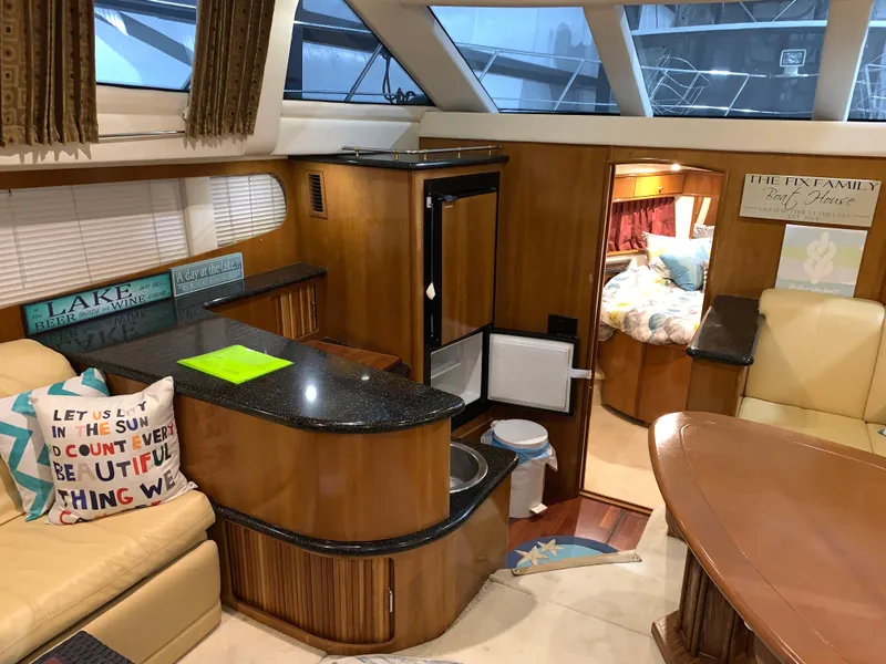 Slide: The Image of Interior of 2001 Carver 396 Motor Yacht with cozy seating and modern amenities. - 24