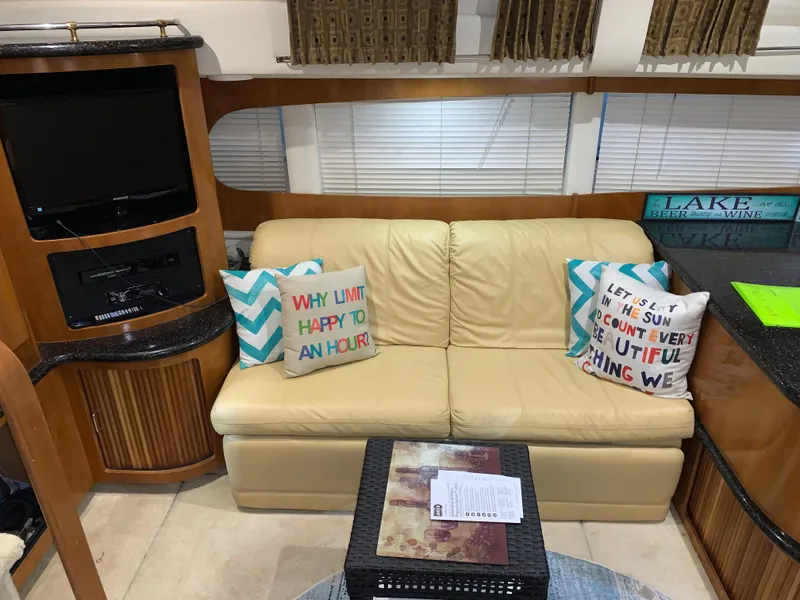 Slide: The Image of Interior of 2001 Carver 396 Motor Yacht with beige sofa and decorative pillows. - 27
