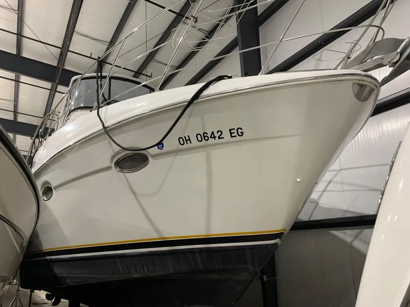 Slide: The Image of 2001 Carver 396 Motor Yacht in storage, side view with registration number visible. - 3