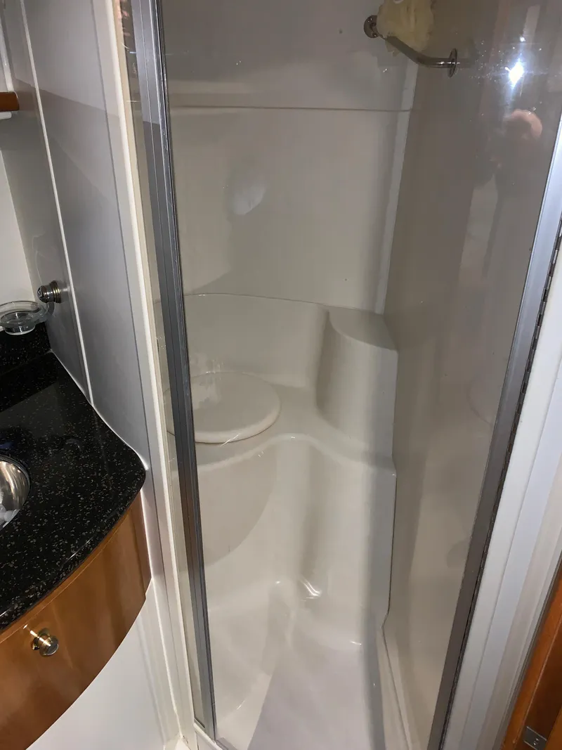 Slide: The Image of 2001 Carver 396 Motor Yacht bathroom with shower and sink. - 32