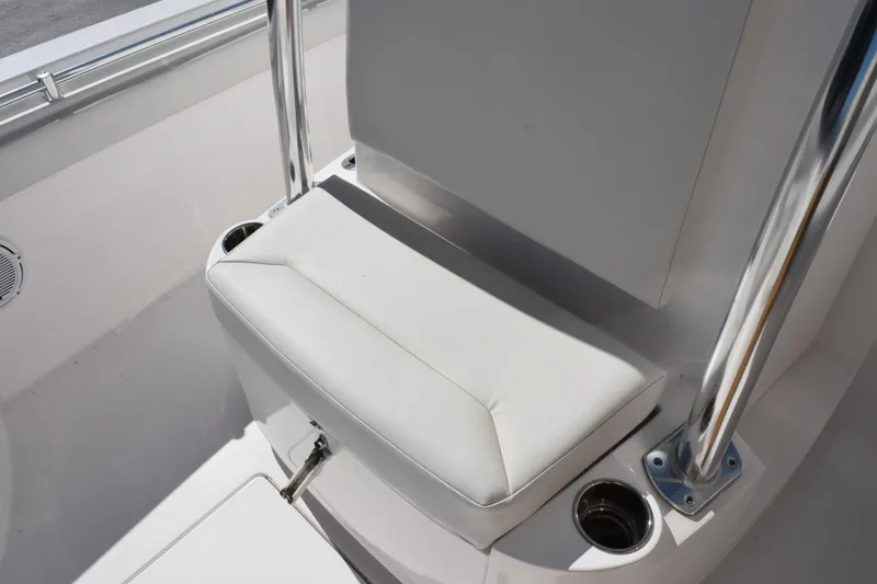 Slide: The Image of 2024 Contender 24 Sport boat seat with stainless steel supports and cup holders. - 12