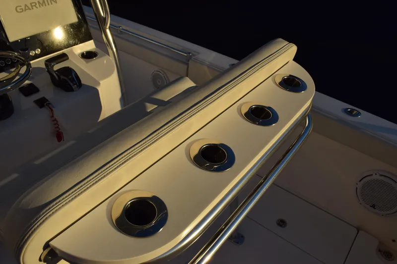 Slide: The Image of 2024 Contender 24 Sport boat interior with rod holders and Garmin equipment. - 29