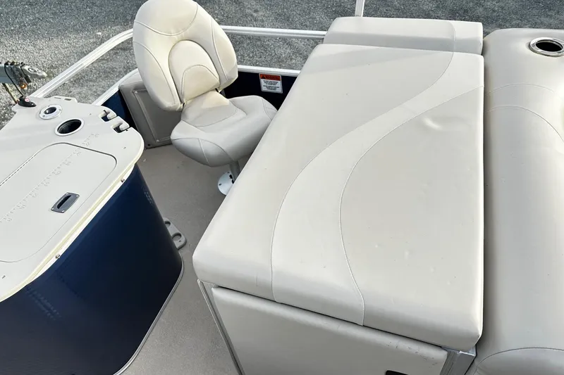 Slide: The Image of 2015 Bennington 2275GS Pontoon interior with white seating and console. - 16