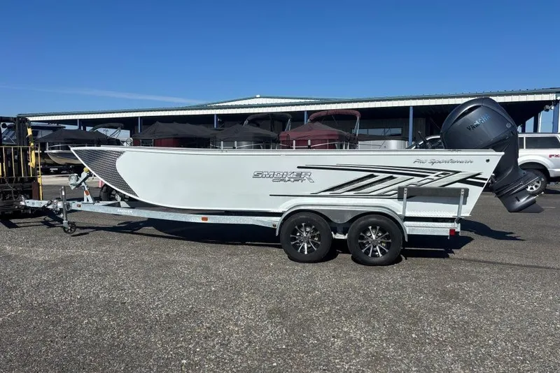 The Image of 2026 Smoker Craft Pro Sportsman 2072 T boat on trailer, parked outdoors. - 0