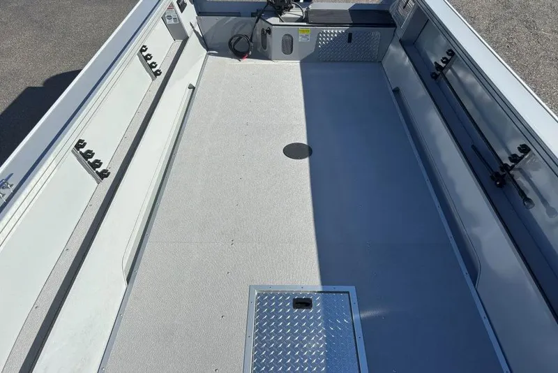 Slide: The Image of 2026 Smoker Craft Pro Sportsman 2072 T boat interior with spacious deck and storage compartments. - 7