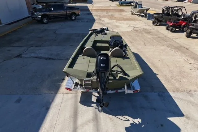 Slide: The Image of 2026 Vexus AVX181 boat with 75 HP engine, parked on concrete lot. - 4