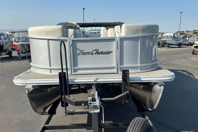 Slide: The Image of 2024 SunChaser Geneva Cruise 22 LR PSB pontoon boat on trailer, outdoor display. - 1