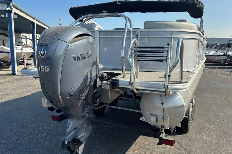 Slide: The Image of 2024 SunChaser Geneva Cruise 22 LR PSB pontoon boat with Yamaha 150 engine. - 2
