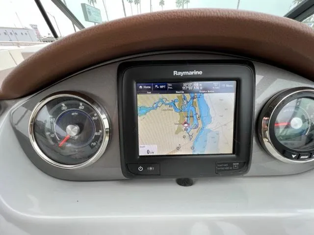 Slide: The Image of Dashboard of 2016 Sea Ray SDX 290 with Raymarine navigation display. - 10