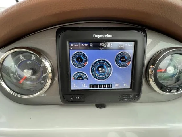 Slide: The Image of Dashboard of 2016 Sea Ray SDX 290 with Raymarine display and gauges. - 11