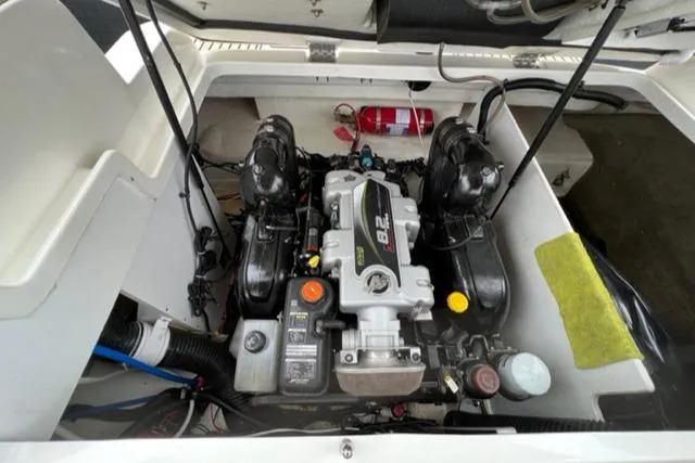 Slide: The Image of Engine compartment of a 2016 Sea Ray SDX 290 boat, featuring a powerful 8.2 engine. - 19