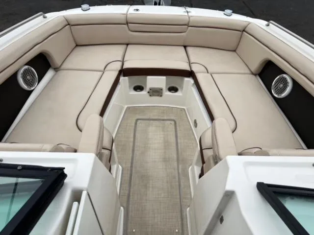 Slide: The Image of 2016 Sea Ray SDX 290 boat interior with beige seating and speakers. - 7