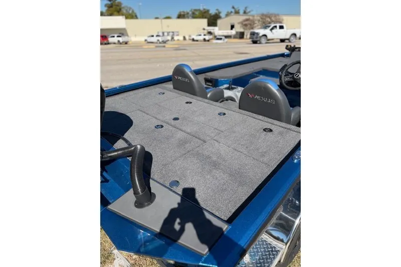 Slide: The Image of 2026 Vexus AVX181 boat interior with gray carpet and dual seats. - 5