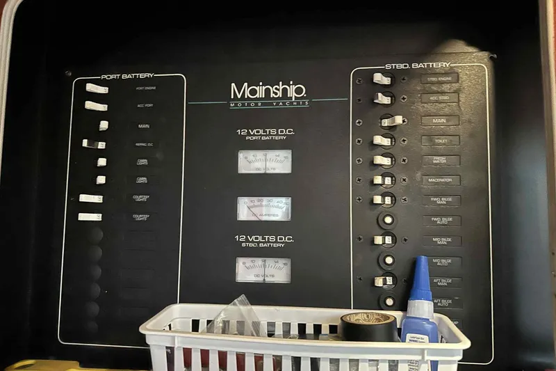 Slide: The Image of Control panel of a 1993 Mainship 39 Express yacht with battery indicators. - 16