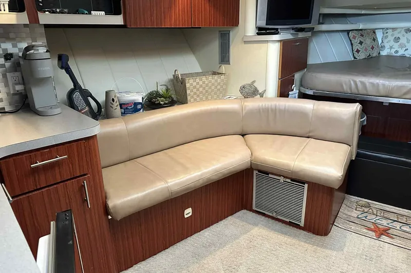 Slide: The Image of Interior of 1993 Mainship 39 Express yacht with beige leather seating and modern amenities. - 3