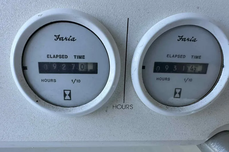 Slide: The Image of Faria elapsed time meters on 1993 Mainship 39 Express, showing hours. - 30