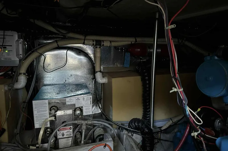 Slide: The Image of Engine room of 1993 Mainship 39 Express with wiring and equipment. - 35