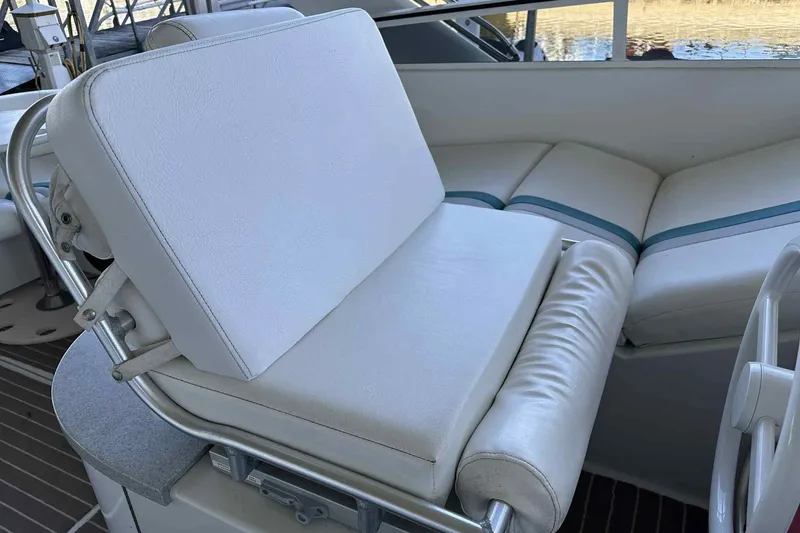 Slide: The Image of White cushioned seating on 1993 Mainship 39 Express boat, featuring sleek design and comfort. - 40