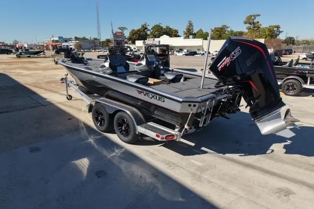 Slide: The Image of 2026 Vexus AVX1985S boat with powerful engine on trailer in outdoor setting. - 2