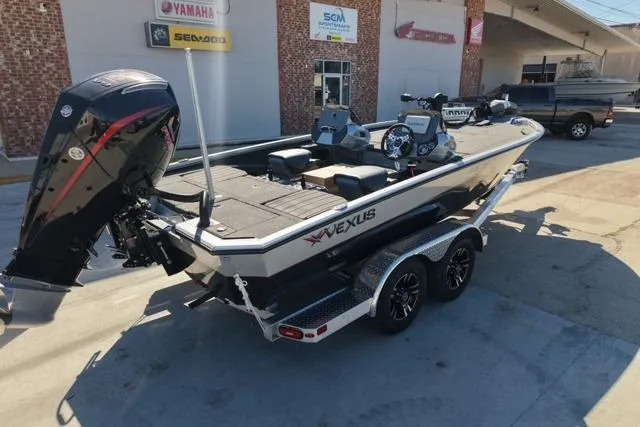 Slide: The Image of 2026 Vexus AVX1985S boat on trailer, parked outside dealership. - 4
