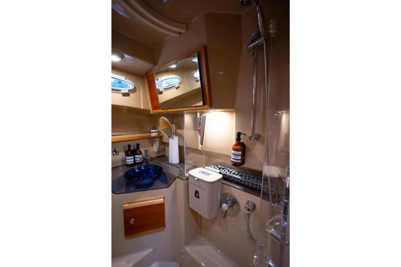 Slide: The Image of Luxurious bathroom in 2016 Cutwater 30 CB yacht with modern fixtures and elegant design. - 11