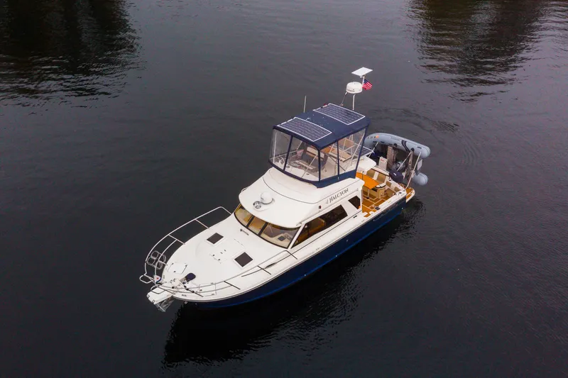 Slide: The Image of Aerial view of 2016 Cutwater 30 CB boat on calm water. - 23