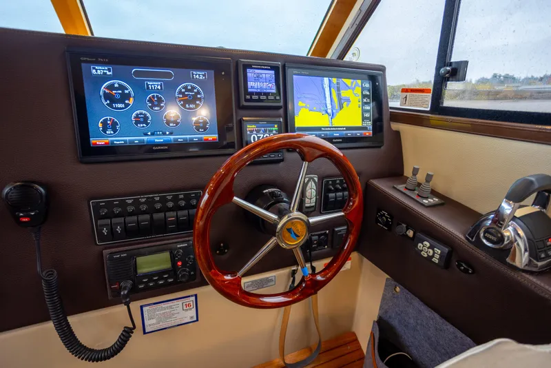Slide: The Image of Helm of 2016 Cutwater 30 CB boat with navigation and control systems. - 9