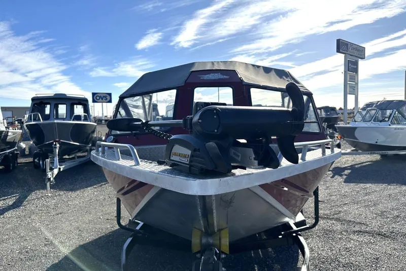 Slide: The Image of 2009 Northwest Jet 196 Freedom boat displayed outdoors under a clear blue sky. - 2