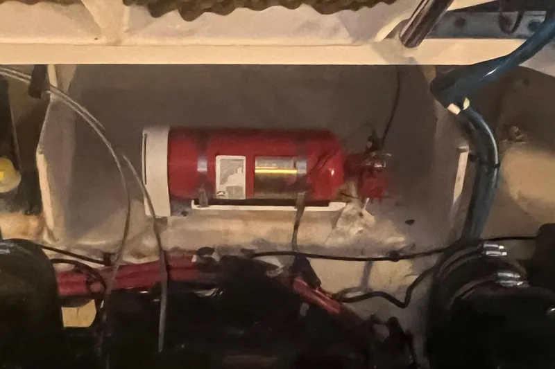 Slide: The Image of Fire extinguisher in 2007 Sea Ray 260 Sundancer engine compartment. - 22