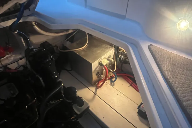 Slide: The Image of Engine compartment of a 2007 Sea Ray 260 Sundancer with visible wiring and components. - 23