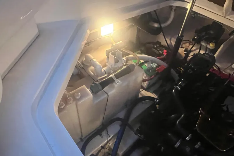 Slide: The Image of Engine compartment of a 2007 Sea Ray 260 Sundancer boat, illuminated interior view. - 24