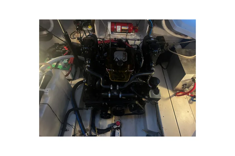 Slide: The Image of Engine compartment of a 2007 Sea Ray 260 Sundancer boat, showing detailed components. - 25
