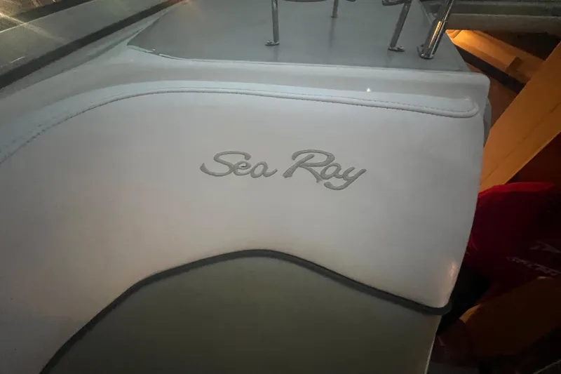 Slide: The Image of 2007 Sea Ray 260 Sundancer interior with logo on white upholstery. - 39