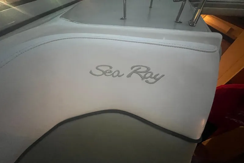 Slide: The Image of 2007 Sea Ray 260 Sundancer interior with logo on white upholstery. - 40