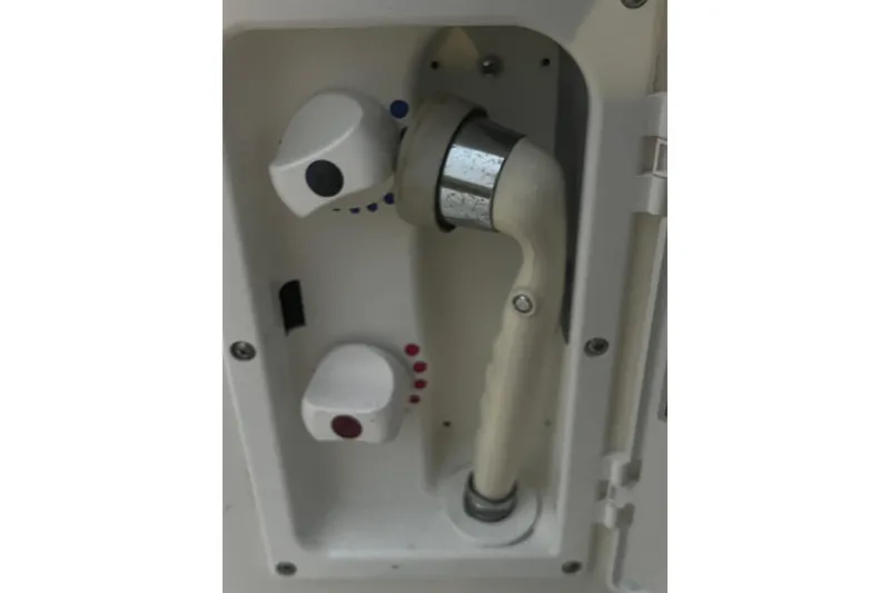 Slide: The Image of 2007 Sea Ray 260 Sundancer shower controls with adjustable knobs and handheld showerhead. - 43