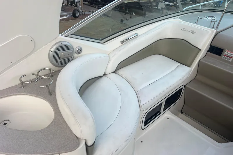 Slide: The Image of 2007 Sea Ray 260 Sundancer interior with white seating and cup holders. - 5
