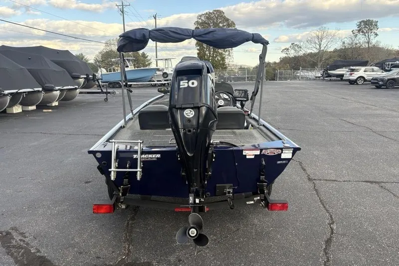Slide: The Image of 2019 Tracker Pro 170 boat with 50 HP motor in parking lot. - 11