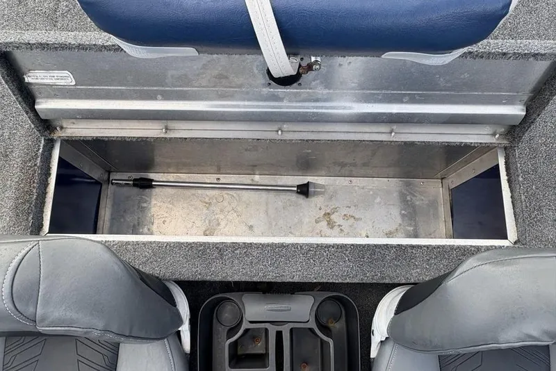 Slide: The Image of 2019 Tracker Pro 170 boat storage compartment with seats and rod holder. - 23