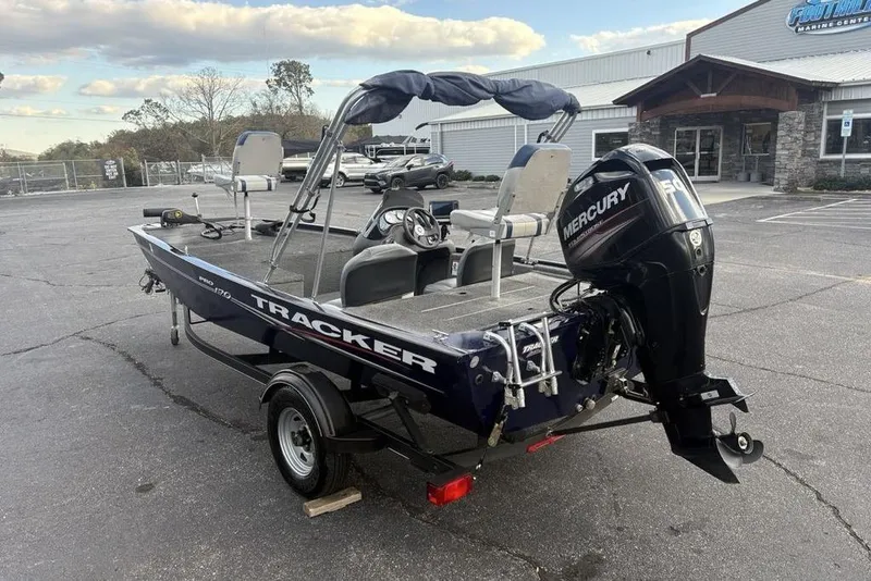 Slide: The Image of 2019 Tracker Pro 170 boat with Mercury engine in a parking lot. - 8