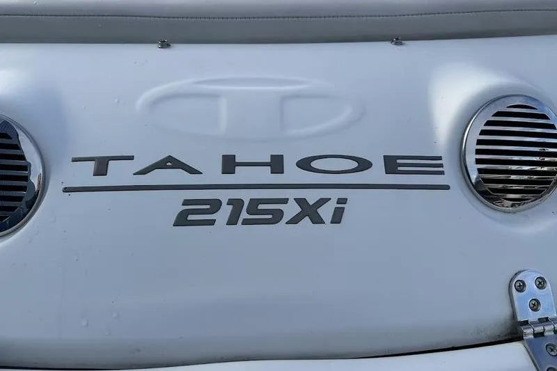 Slide: The Image of 2018 Tahoe 215 Xi boat logo with chrome accents. - 14